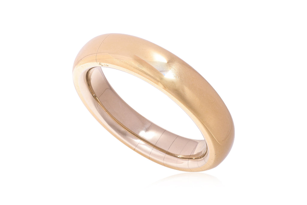 A LARGE GOLD BANGLE BY POMELLATO