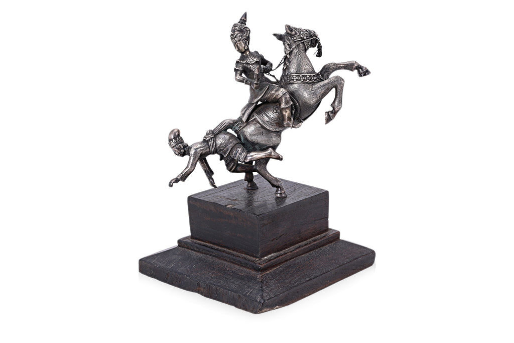 A BURMESE WHITE METAL MODEL OF FIGURES ON HORSEBACK