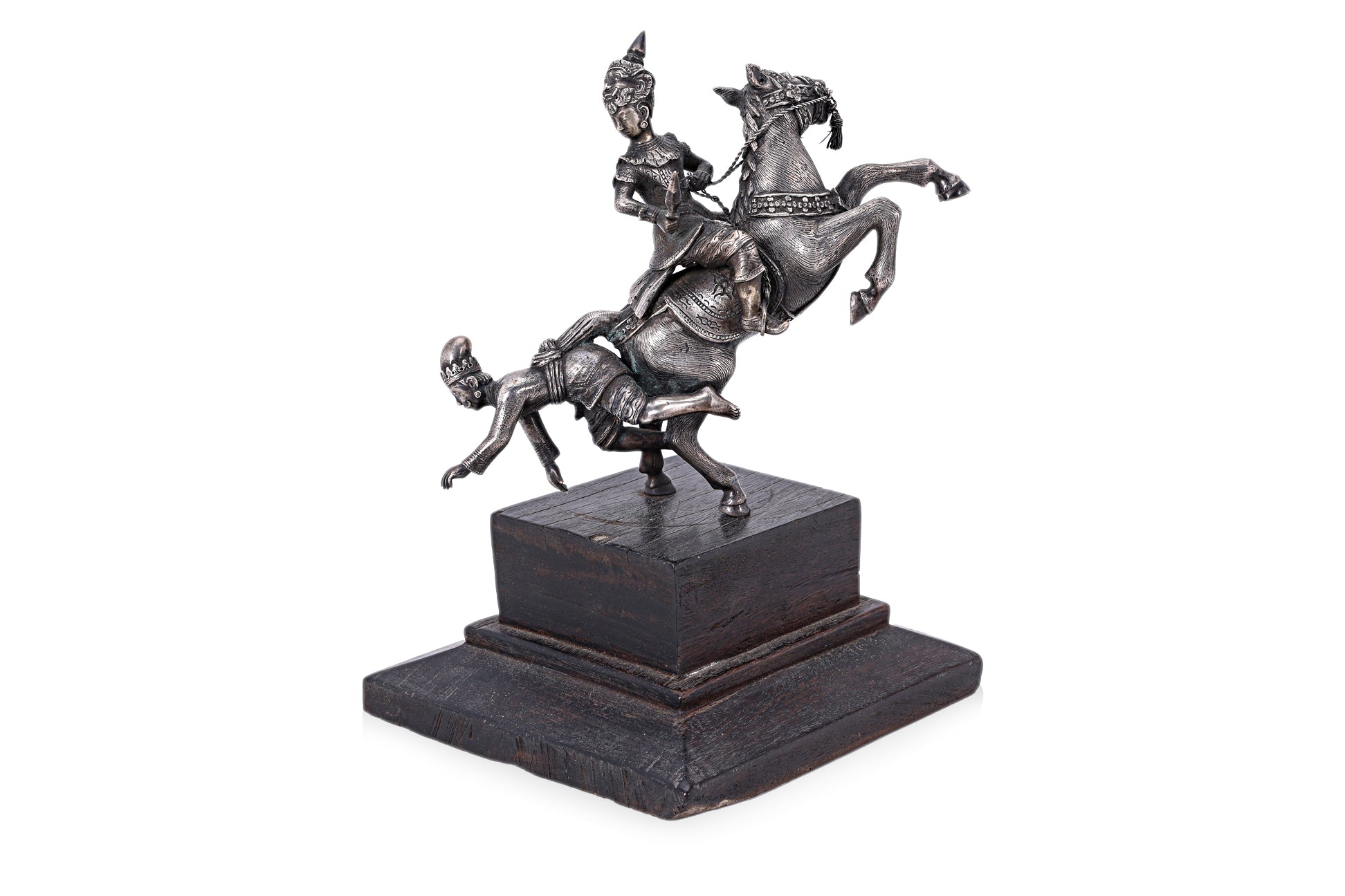A BURMESE WHITE METAL MODEL OF FIGURES ON HORSEBACK