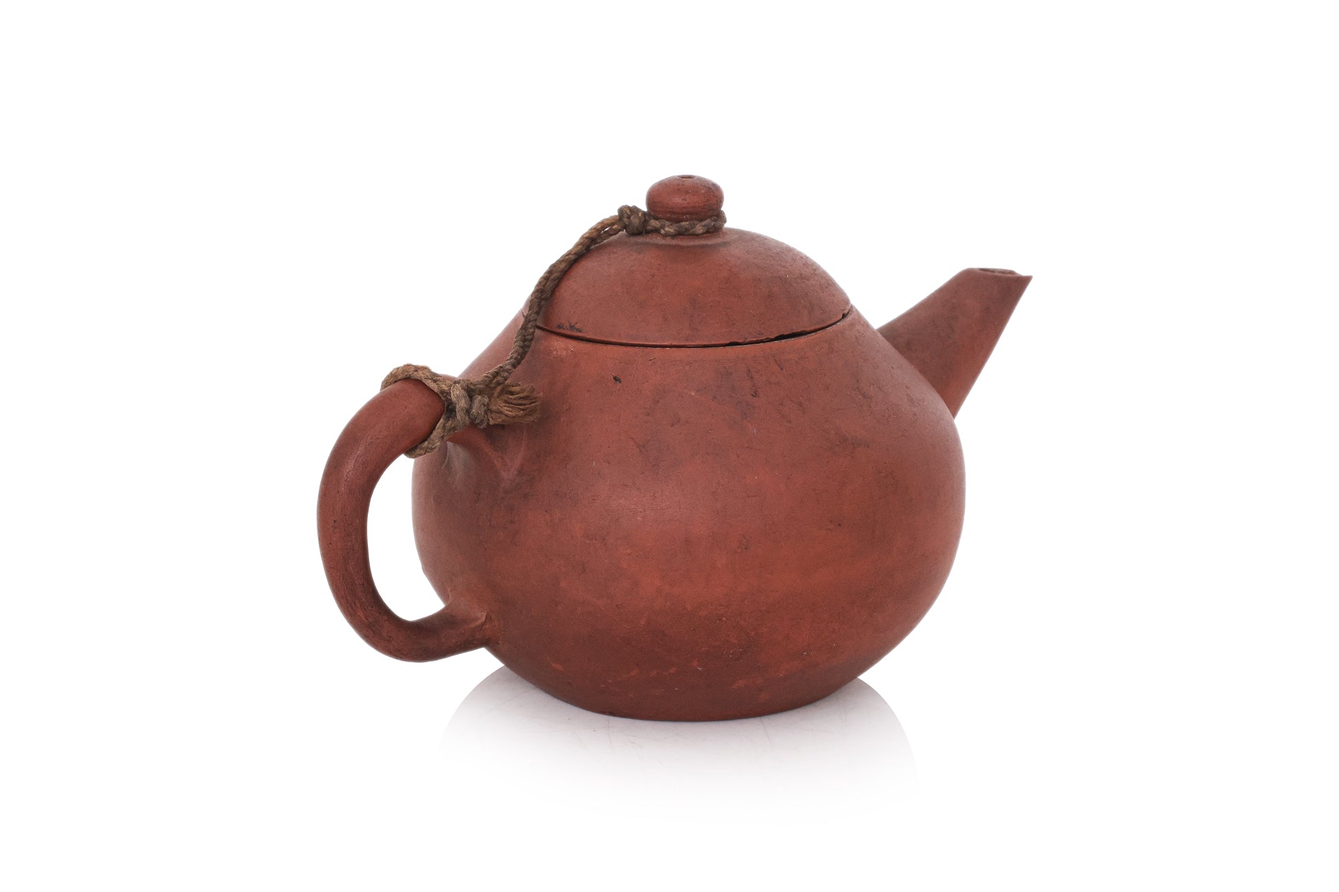 A YIXING POTTERY TEAPOT AND COVER