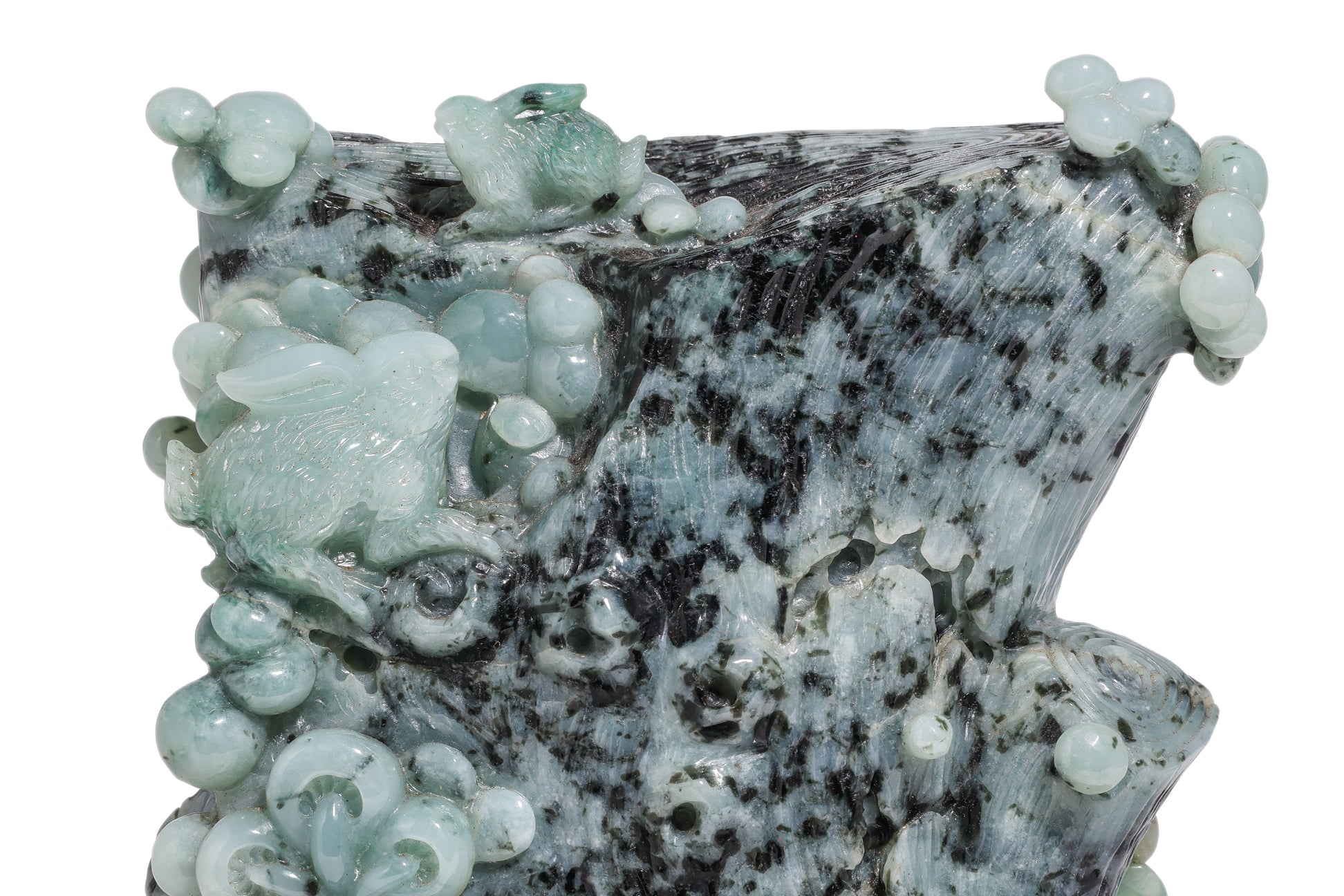 A CARVED GREEN JADE SCULPTURE