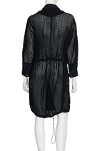 3.1 PHILLIP LIM - A BLACK COAT WITH BLUE STRIPED INNER LAYER