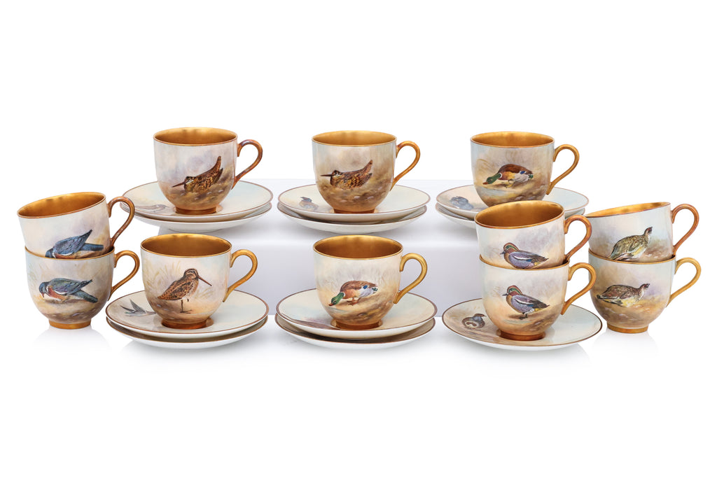 A HARLEQUIN SET OF ELEVEN ROYAL WORCESTER 'GAME BIRDS' PORCELAIN COFFEE CUPS AND SAUCERS (11)