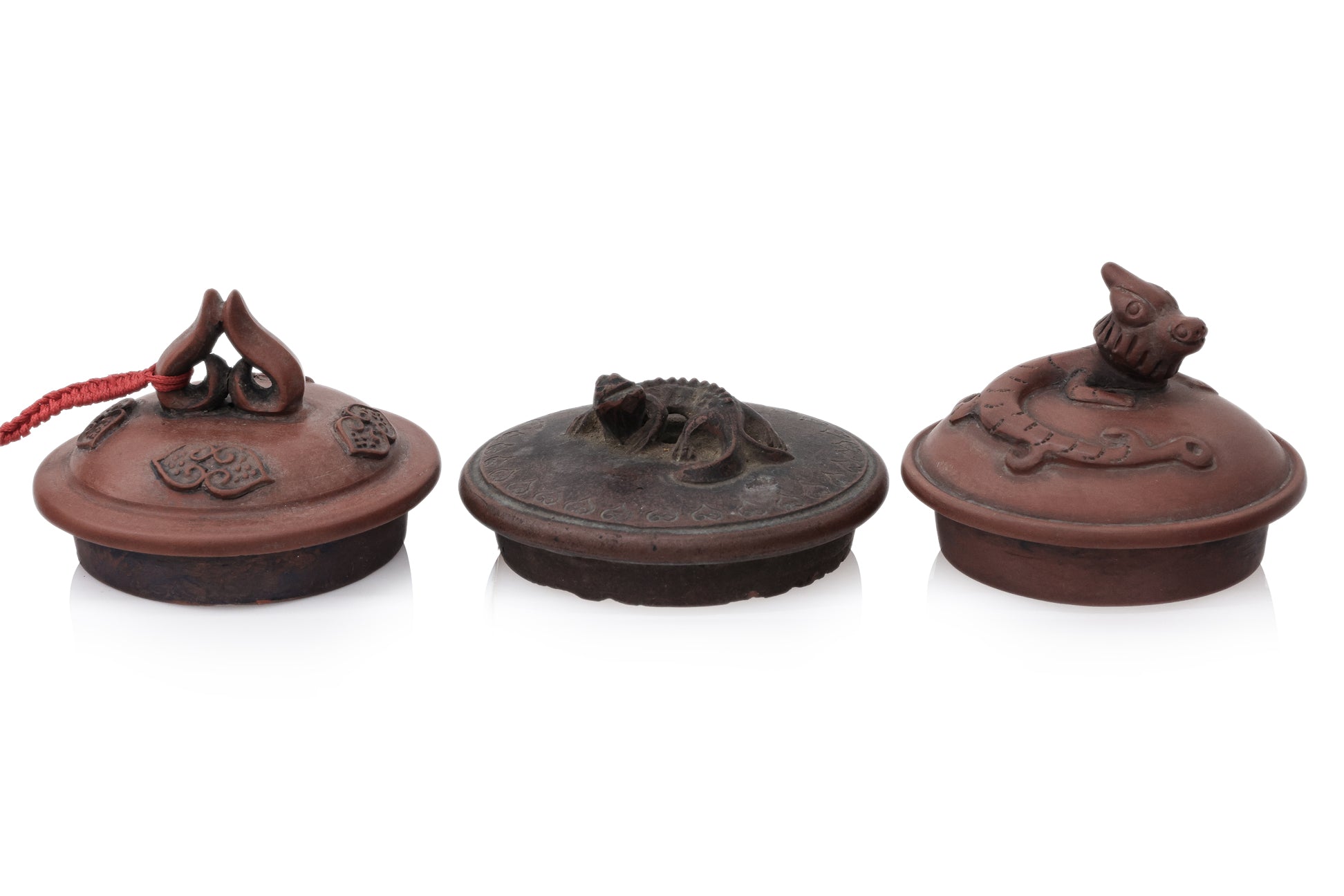 A GROUP OF SIX YIXING ZISHA POTTERY TEAPOTS