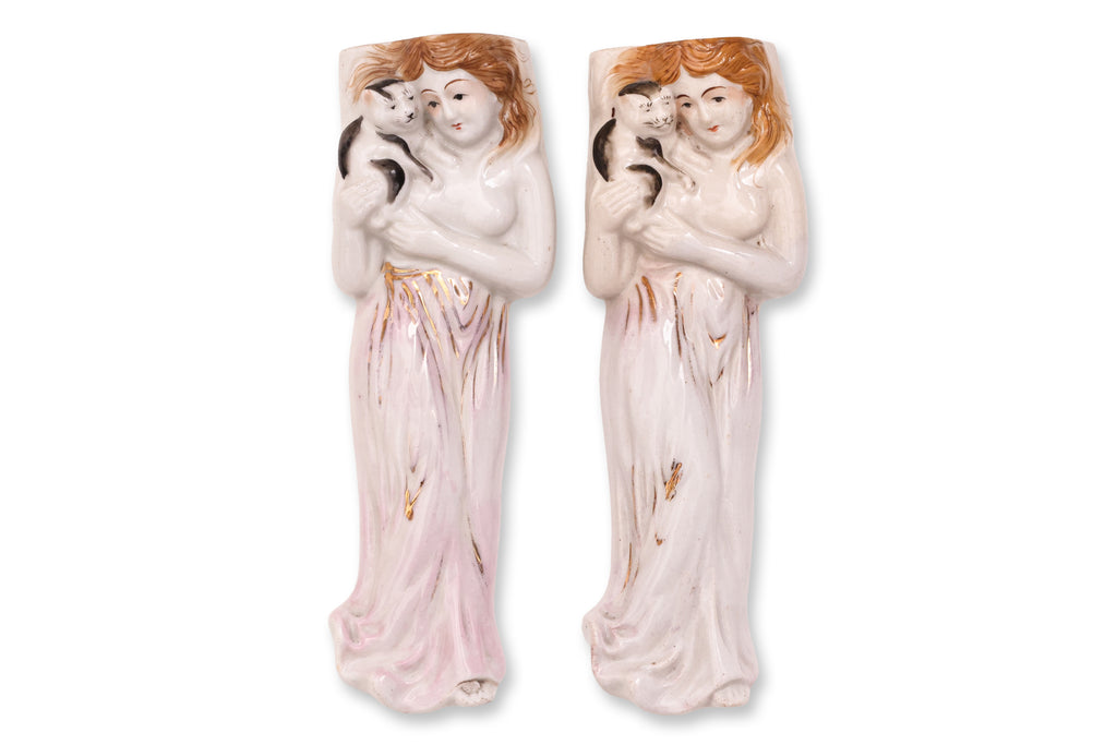 A GROUP OF FOUR FIGURAL PORCELAIN WALL POCKETS
