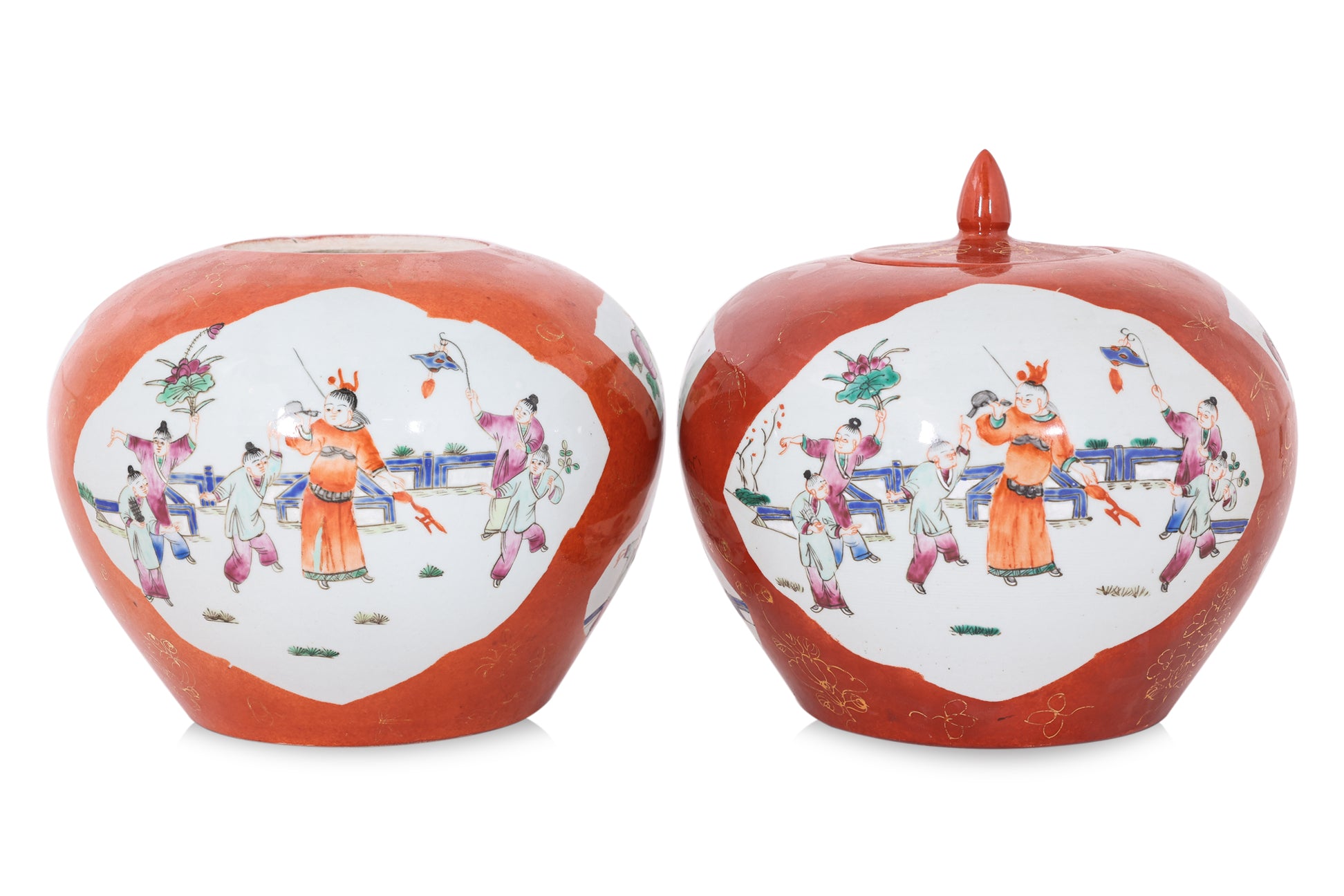 A PAIR OF CORAL GROUND FAMILLE ROSE PORCELAIN JARS