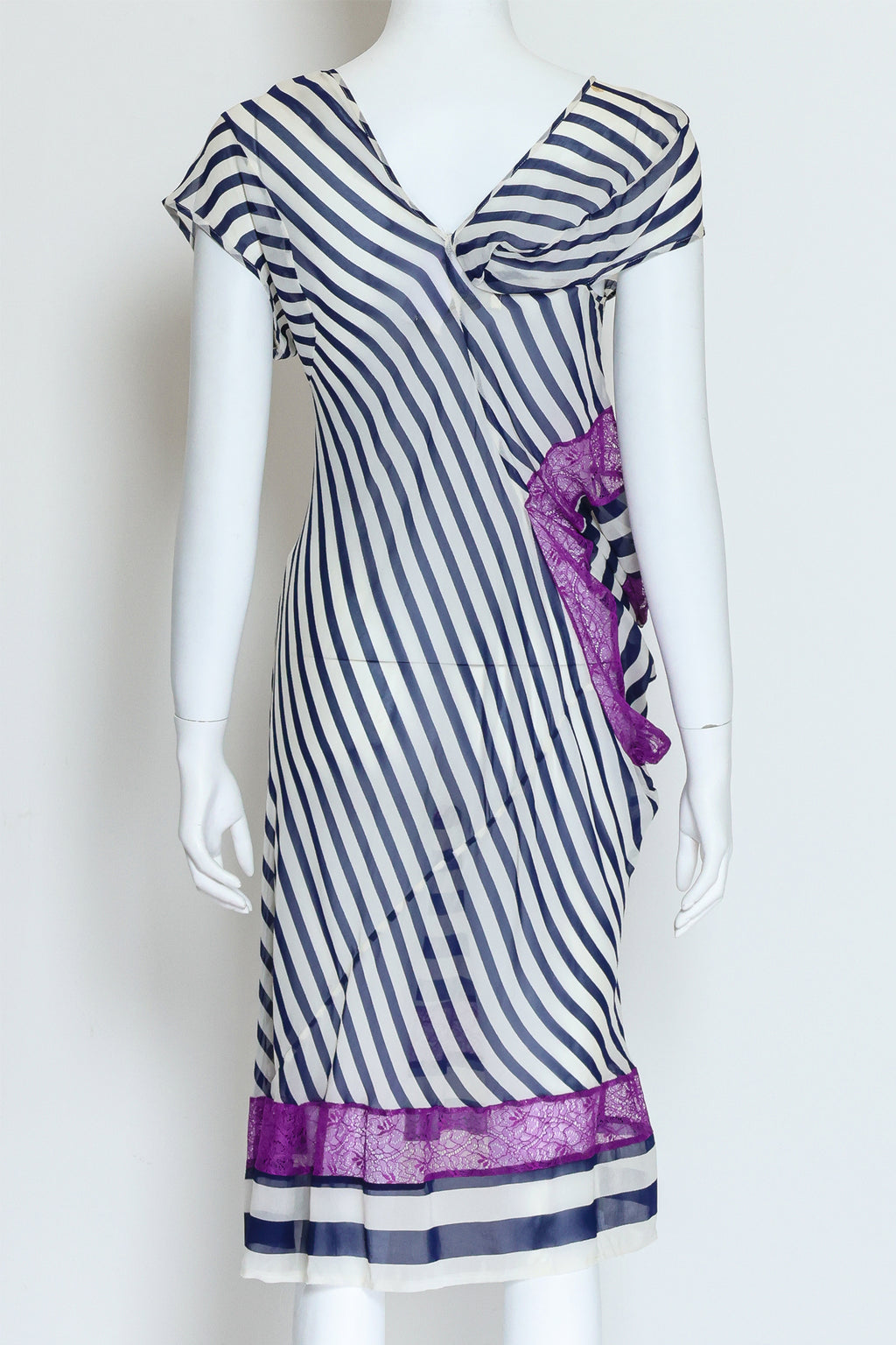 JUNYA WATANABE COMME DES GARÇONS – A BLACK AND WHITE STRIPED DRESS WITH PURPLE LACE