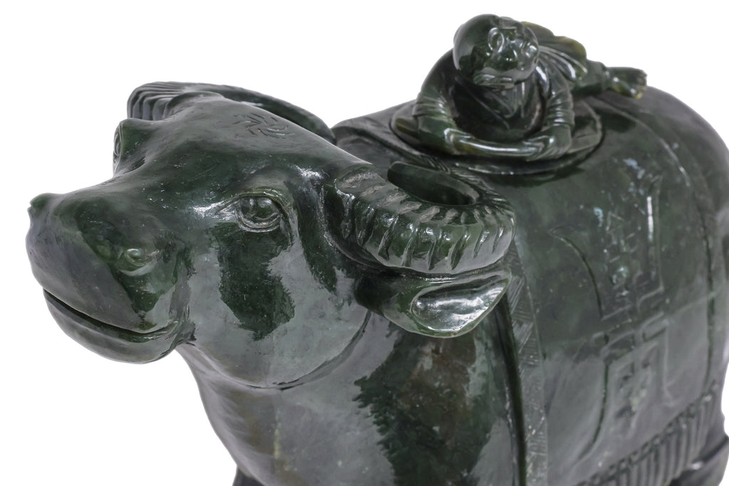 A LARGE SPINACH JADE BUFFALO AND BOY VESSEL