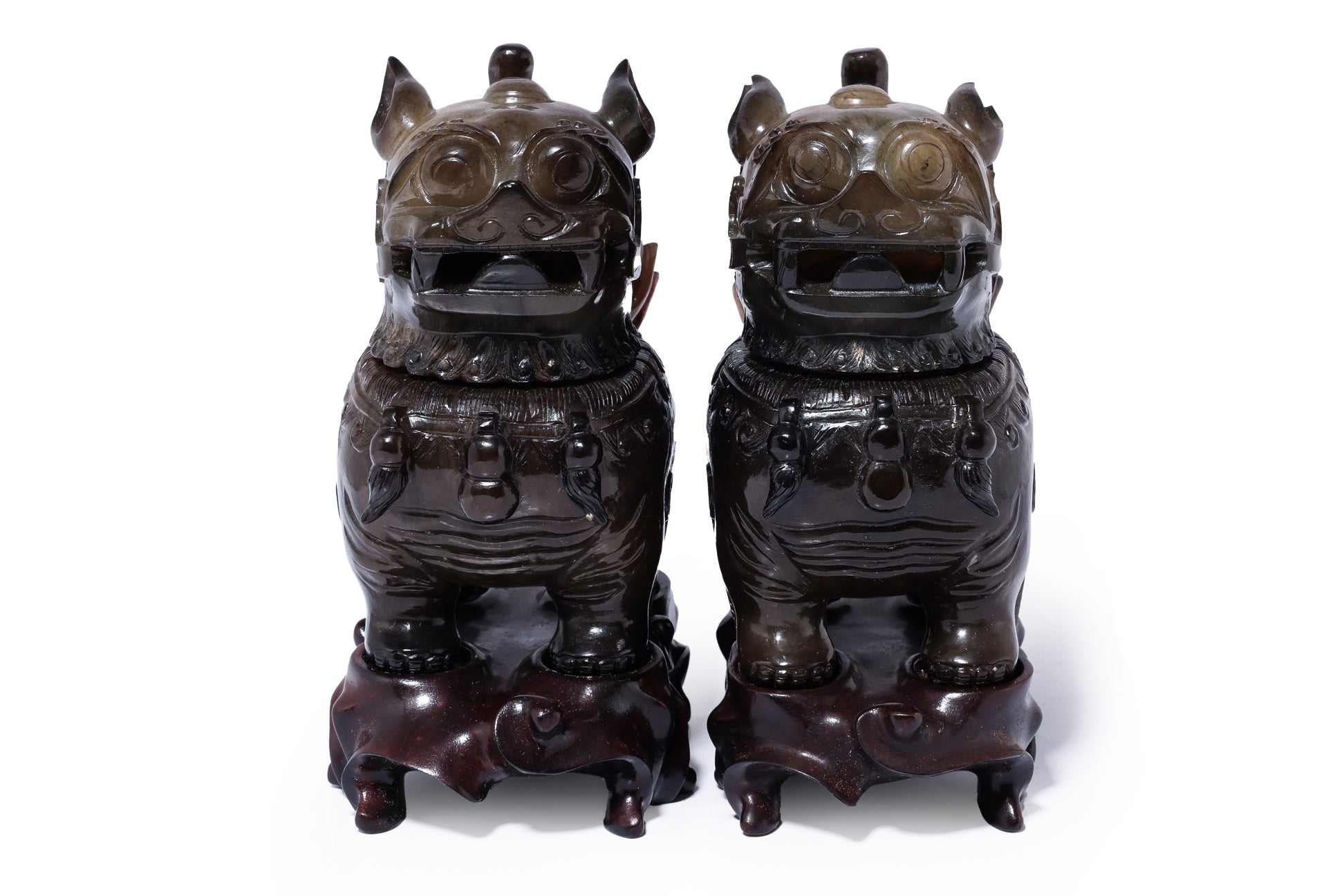 A PAIR OF JADE FOO LION-FORM VESSELS