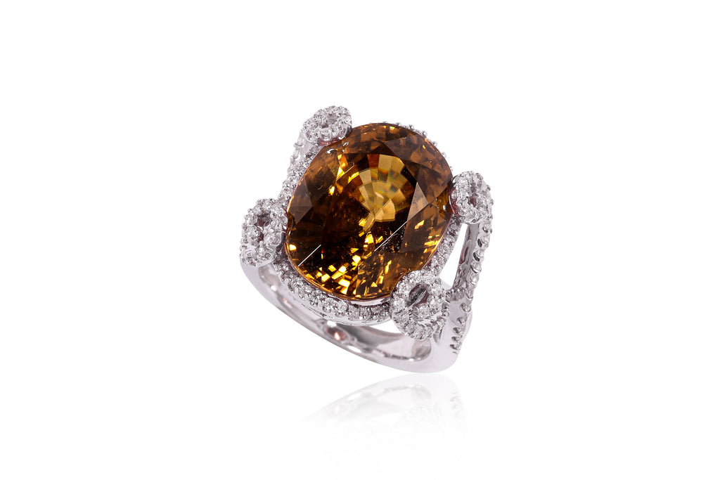 A LARGE ZIRCON AND DIAMOND RING
