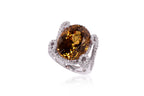 A LARGE ZIRCON AND DIAMOND RING