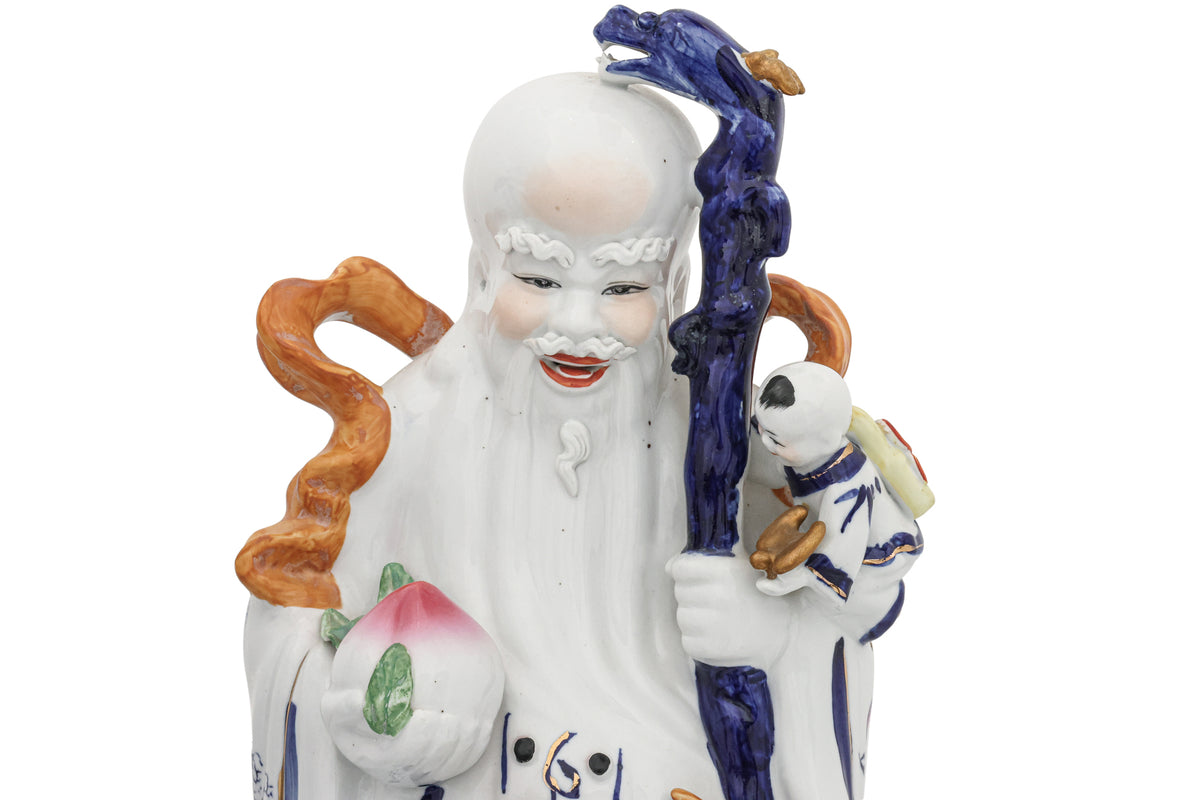 A SET OF THREE CHINESE PORCELAIN FU, LU, SHOU FIGURES