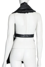NOIR KEI NINOMIYA - A SYNTHETIC LEATHER AND FAUX FUR VEST, FALL RTW 2019