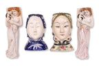 A GROUP OF FOUR FIGURAL PORCELAIN WALL POCKETS