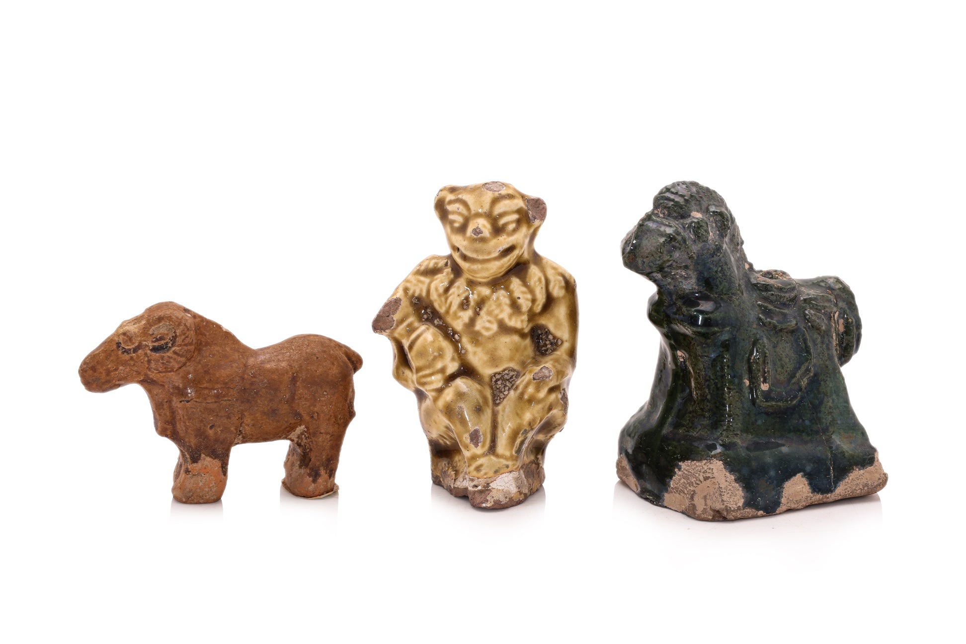 A GROUP OF SIX POTTERY FIGURES
