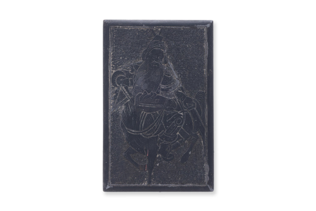 A INK STONE WITH CARVED GUANDI TO COVER