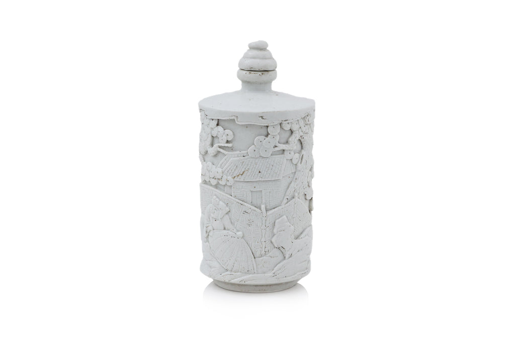 A SMALL WHITE GLAZED PORCELAIN BOTTLE