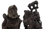 A SOAPSTONE AND A HARDWOOD CARVED FIGURE OF A MONK