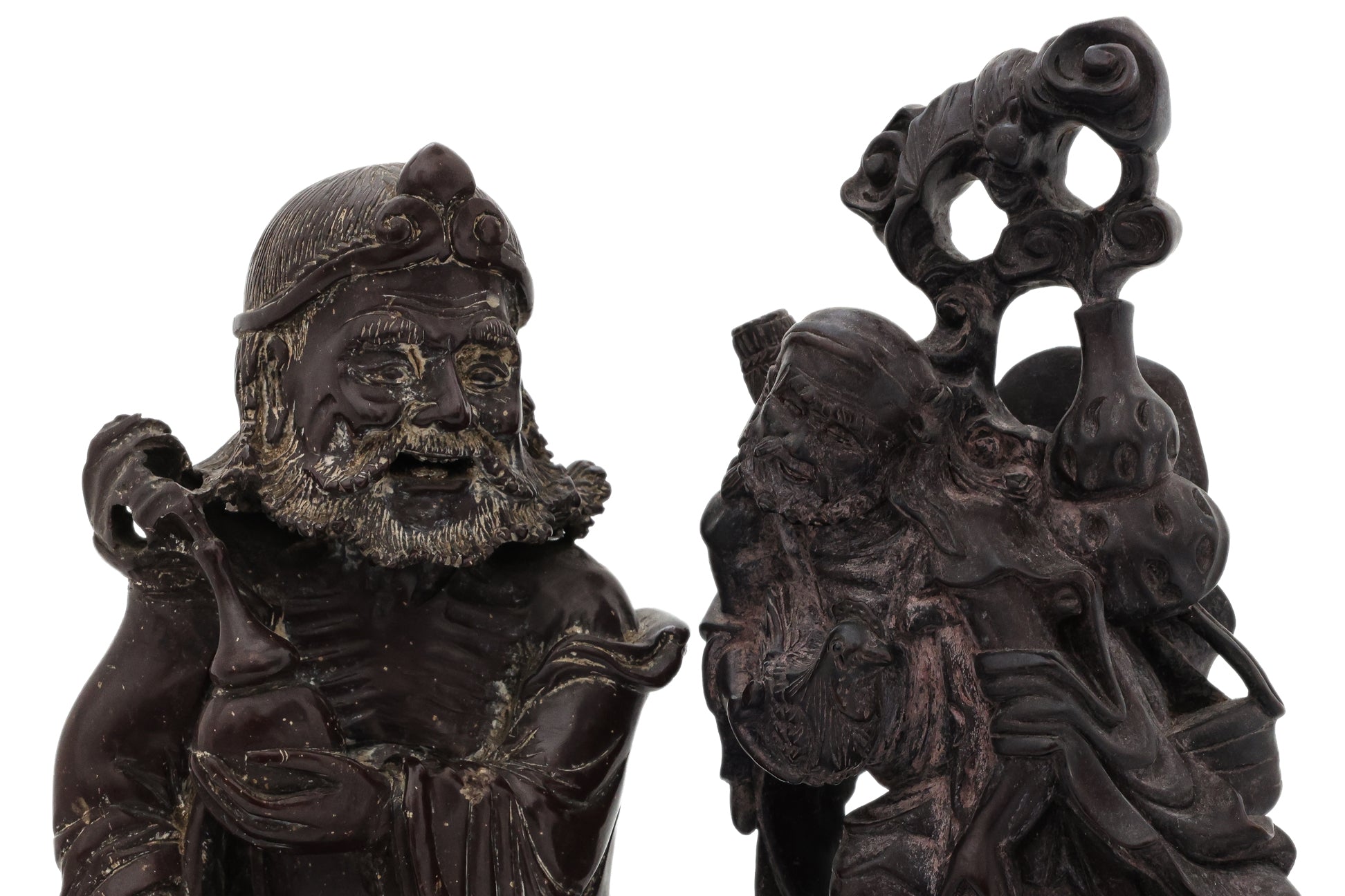 A SOAPSTONE AND A HARDWOOD CARVED FIGURE OF A MONK