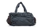 MONCLER - A QUILTED LEATHER BAG