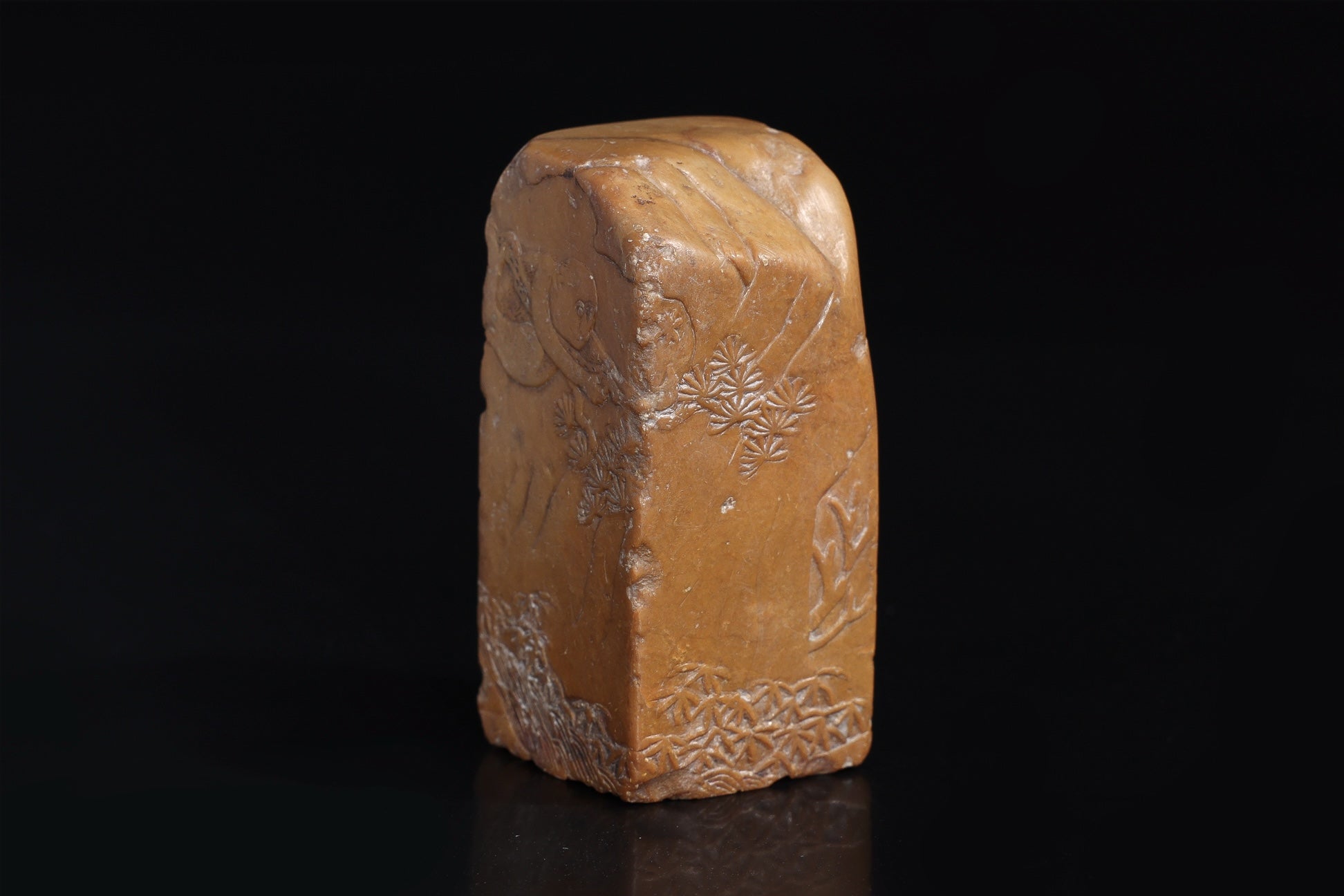 A CARVED AND INSCRIBED SOAPSTONE SEAL