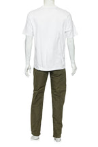 COMME DES GARCONS HOMME - A WHITE T-SHIRT AND OLIVE TROUSERS ENSEMBLE