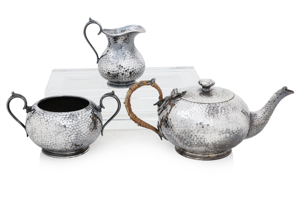 AN ENGLISH SILVER PLATED THREE PIECE TEA SERVICE AND TWO HIP FLASKS