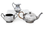 AN ENGLISH SILVER PLATED THREE PIECE TEA SERVICE AND TWO HIP FLASKS