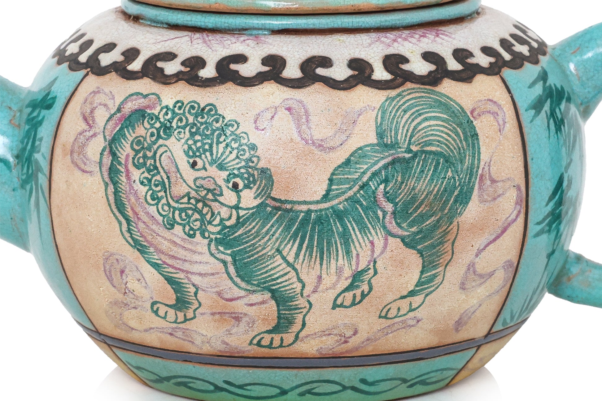 AN ENAMELLED POTTERY TEAPOT AND COVER