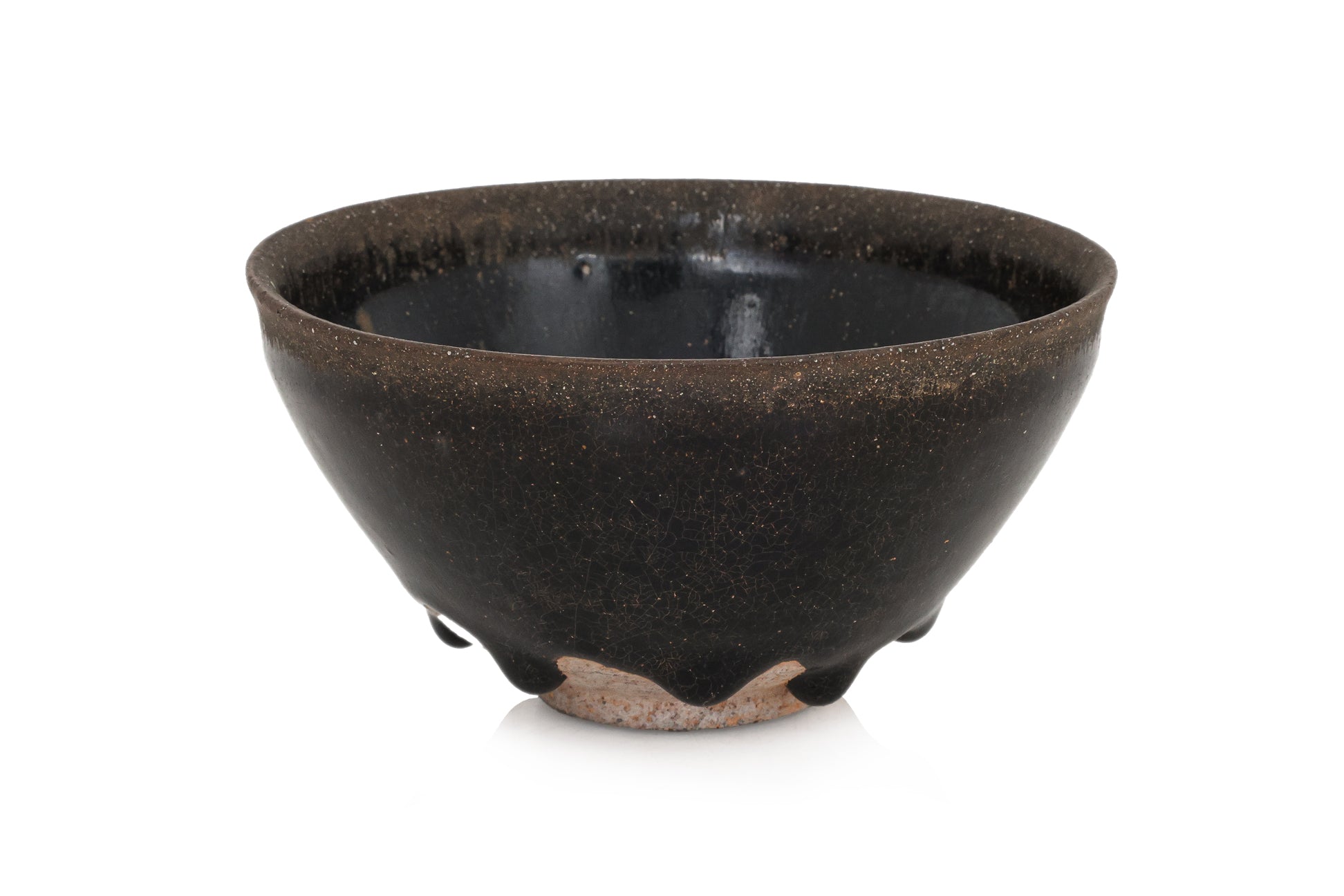 A BLACK GLAZED STONEWARE BOWL
