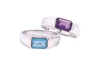 A BLUE TOPAZ RING TOGETHER WITH AN AMETHYST RING