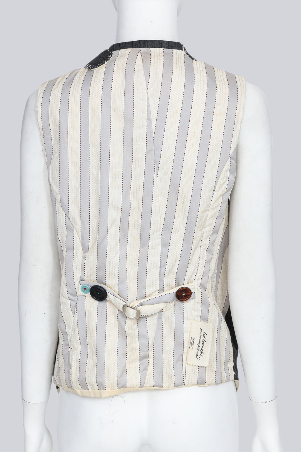 UNDERCOVER JUN TAKAHASHI - AN A/W 2004-2005 SLEEVELESS BLAZER WITH MULTI-COLOURED BUTTONS