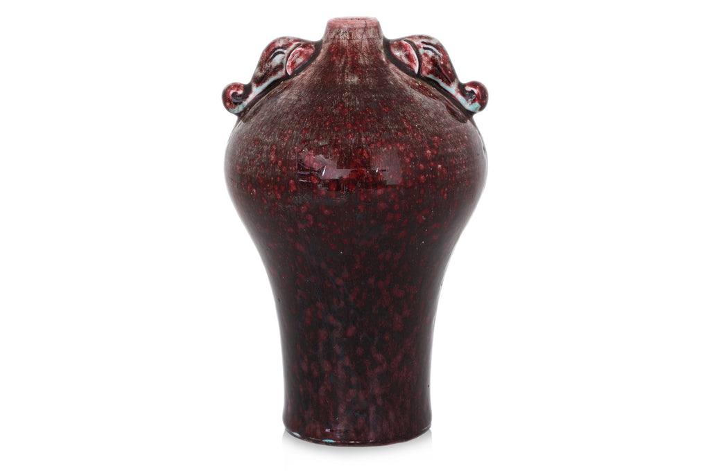 A FLAMBE VASE WITH ELEPHANT LUGS