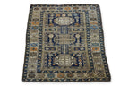 AN ANTIQUE CAUCASIAN WOOL RUG (165 X 125CM)