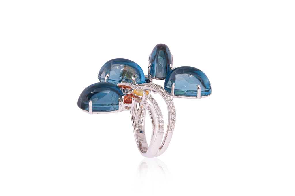 A BLUE TOPAZ, SAPPHIRE AND DIAMOND RING