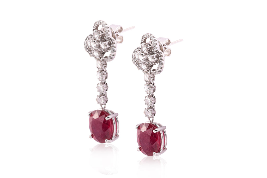 A PAIR OF LEAD GLASS FILLED RUBY AND DIAMOND EARRINGS
