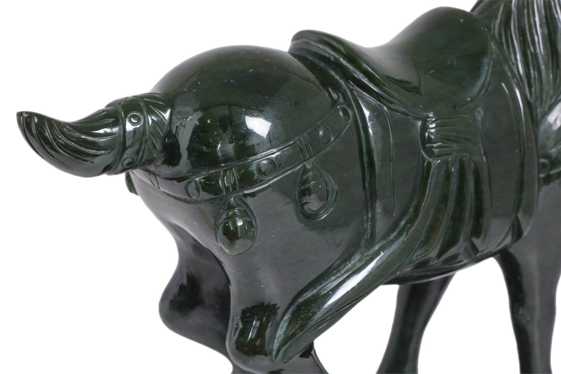 A SPINACH JADE MODEL OF A HORSE
