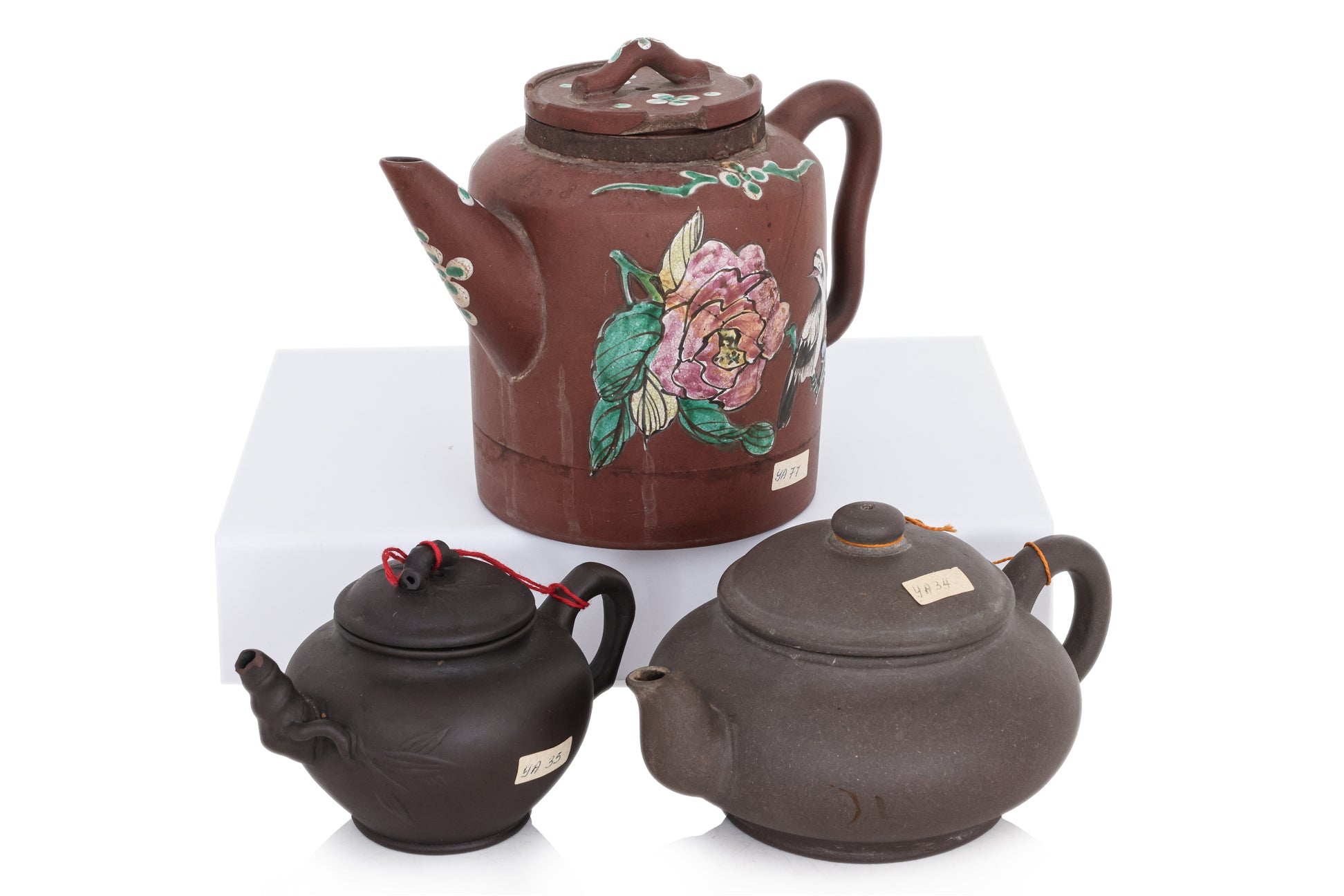 A GROUP OF THREE YIXING POTTERY TEAPOTS