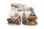 TWO PORCELAIN FIGURES AND A FIGURAL WALL POCKET