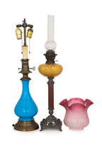 A VICTORIAN OIL LAMP AND AN ELECTRIC BRASS AND PORCELAIN LAMP