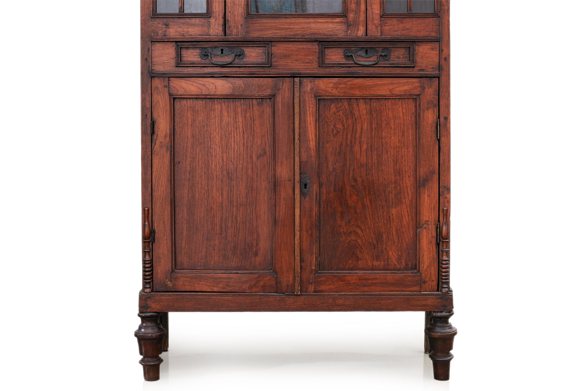 A SMALL GLAZED TEAK CABINET