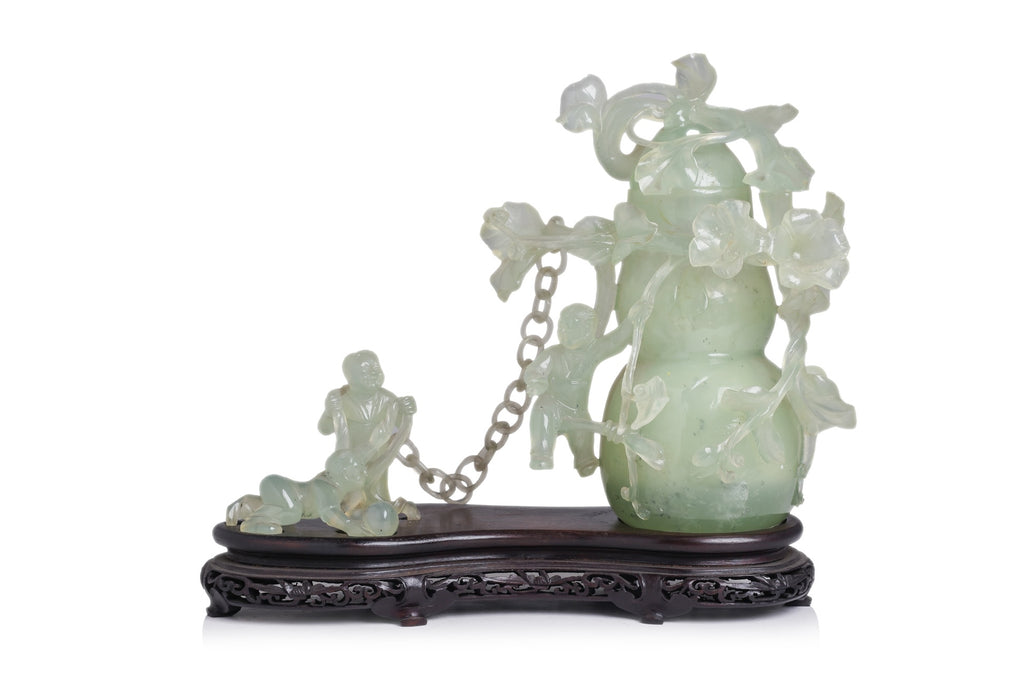 A SERPENTINE JADE DOUBLE GOURD VASE AND COVER