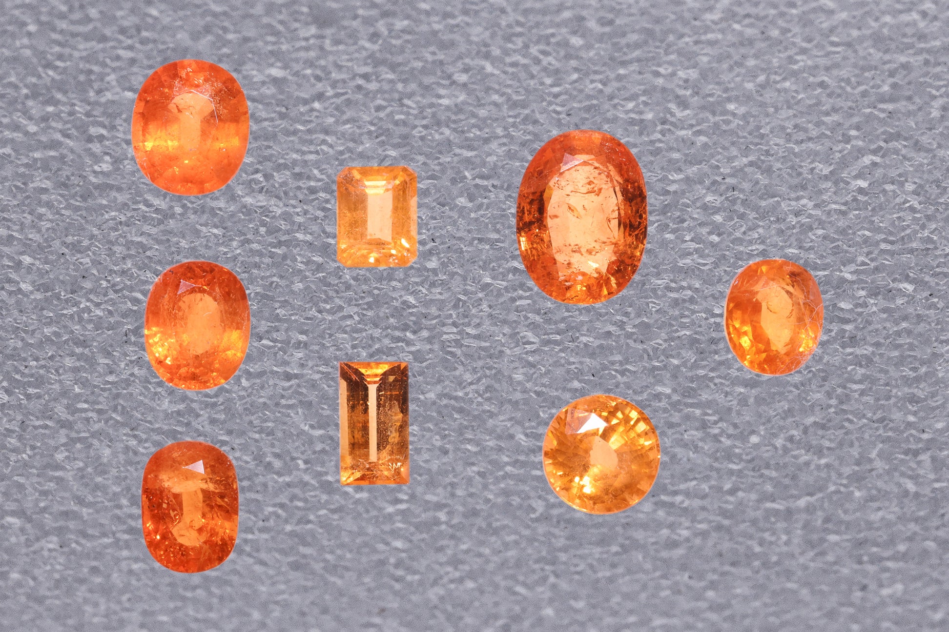 A GROUP OF UNMOUNTED SPESSARTINE GARNETS