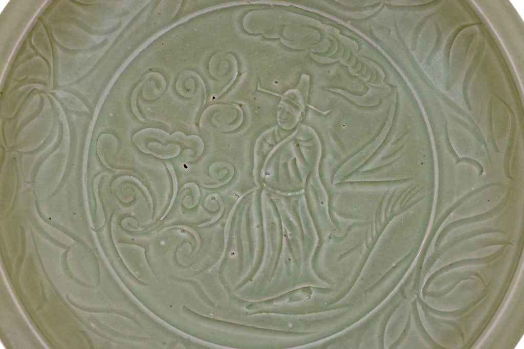 A LARGE CARVED LONGQUAN CELADON DISH