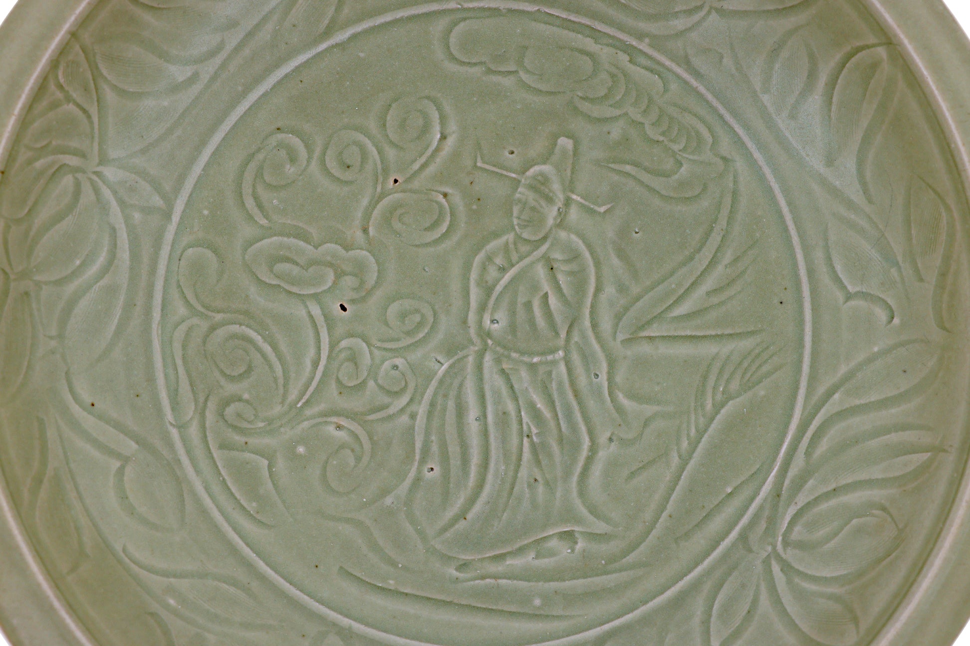 A LARGE CARVED LONGQUAN CELADON DISH