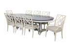 A LARGE EXTENDING OVAL DINING TABLE AND EIGHT CHAIRS