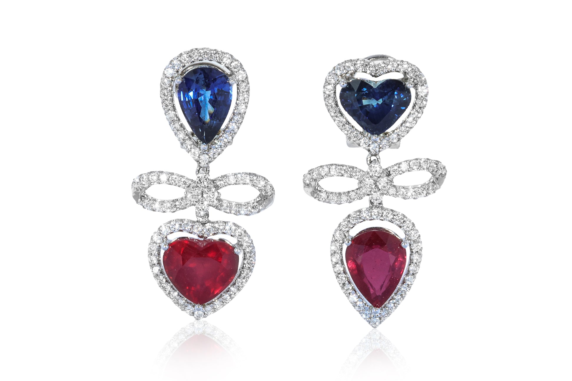 A PAIR OF BLUE SAPPHIRE AND GLASS-FILLED RUBIES EARRINGS
