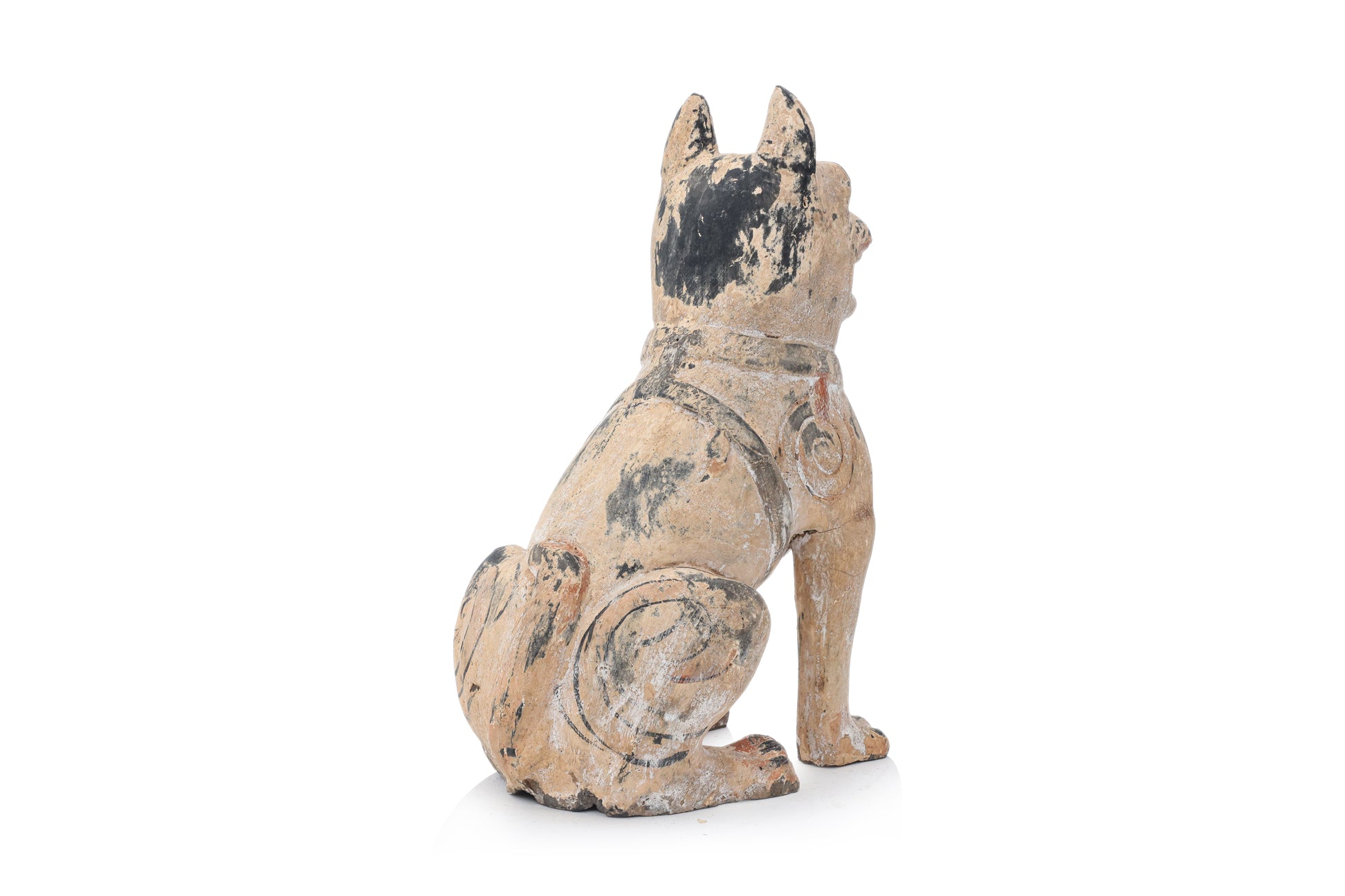 A PAINTED EARTHENWARE POTTERY MODEL OF A DOG