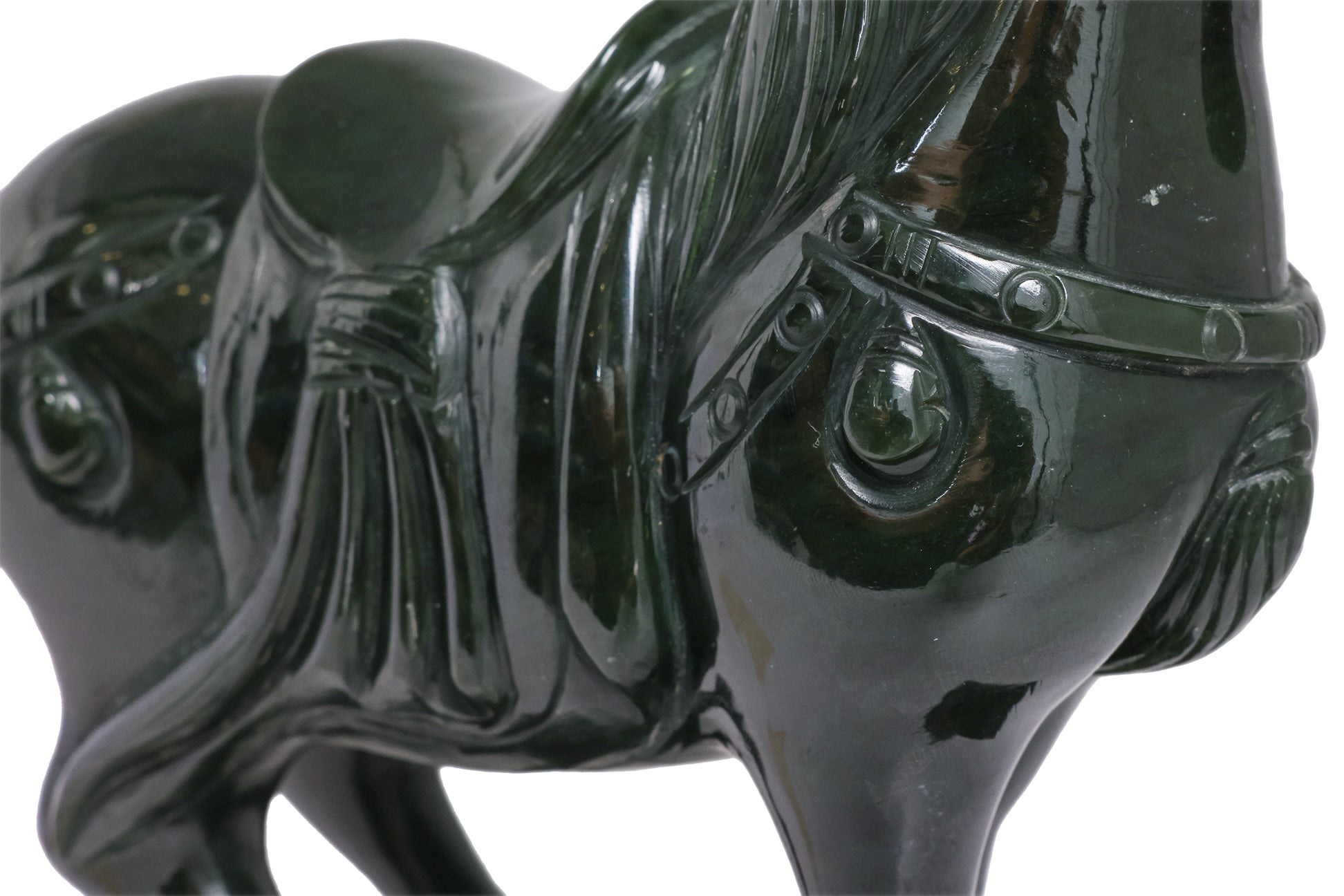A SPINACH JADE MODEL OF A HORSE