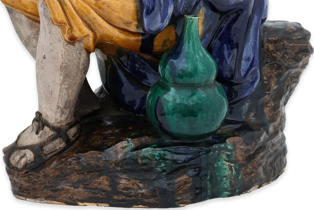 A LARGE SHIWAN POTTERY FIGURE OF A SEATED LUOHAN